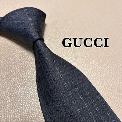 Gucci tie, GG pattern, striped, dotted, checked, black color.