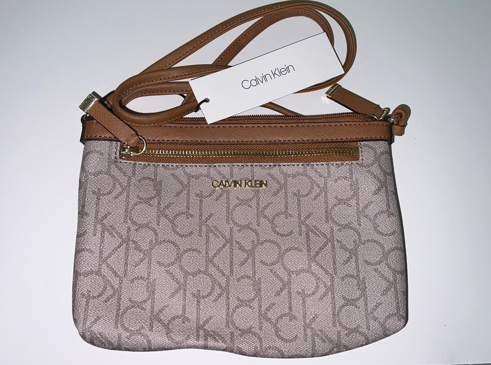 Calvin Klein Monogram Logo Zip Top Womens Swing Bag, Brown