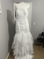 Beautiful white organza mermaid wedding dress with ruffles and train
