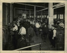 1930 Press Photo View of pressing department at clothing factory in Milwaukee
