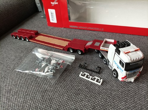 Herpa H0 1:87 in confezione originale - 307765 MB Arocs SLT autoarticolato a pianale ribassato "Tschudy" (CH) - Foto 6 di 8