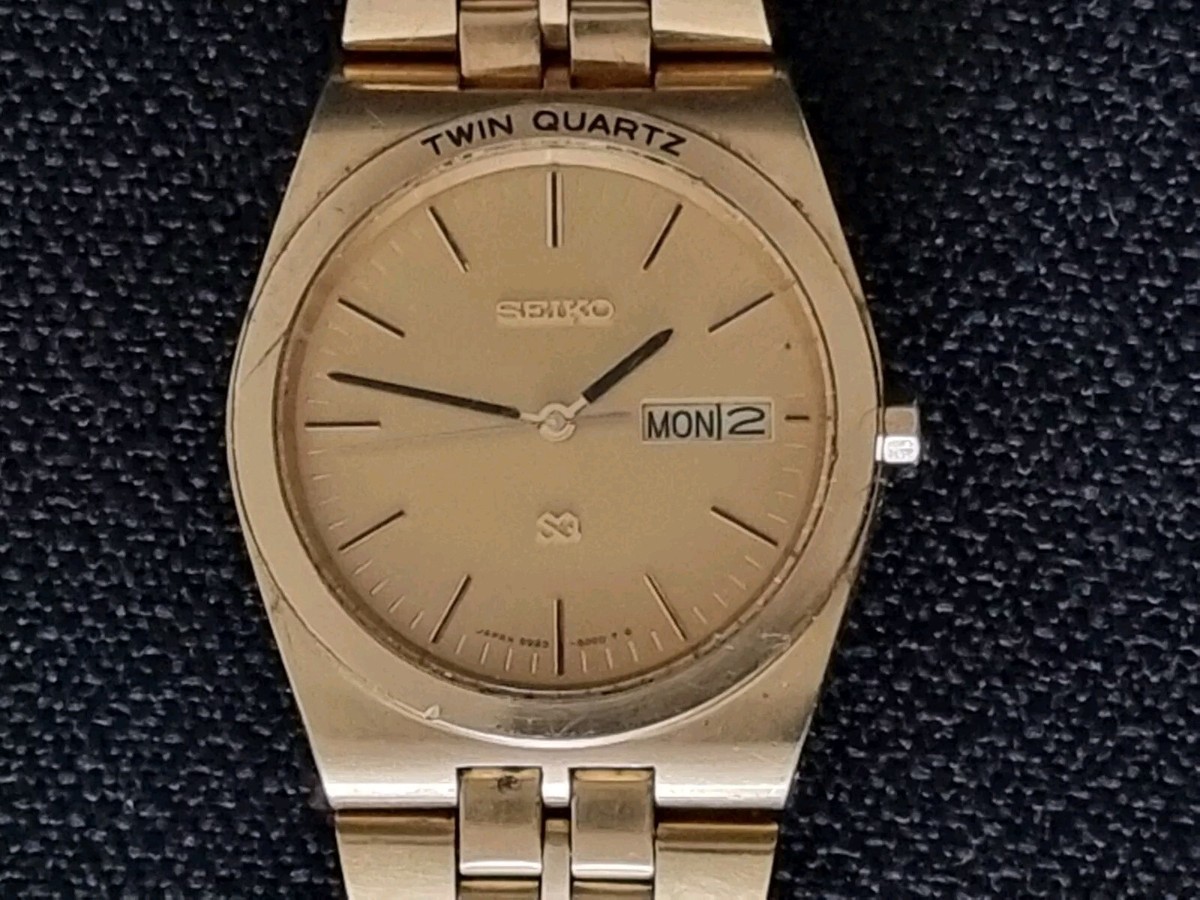 SEIKO 9923 8000 TWIN QUARTZ WATCH CHAMPAGNE GOLD DIAL SS STRAP A
