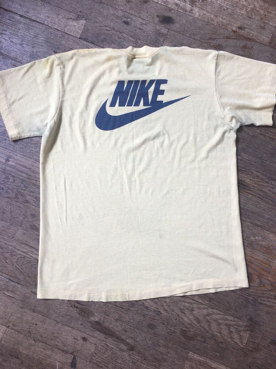 Vintage 1980s 80s Nike Swoosh Yellow Cotton Blend T Shirt Vintage 1980s 80s Nike Swoosh Yellow Cotton Blend T Shirt