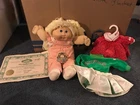 Vintage 1983 Cabbage Patch Kid with two extra Cabbage Patch outfits