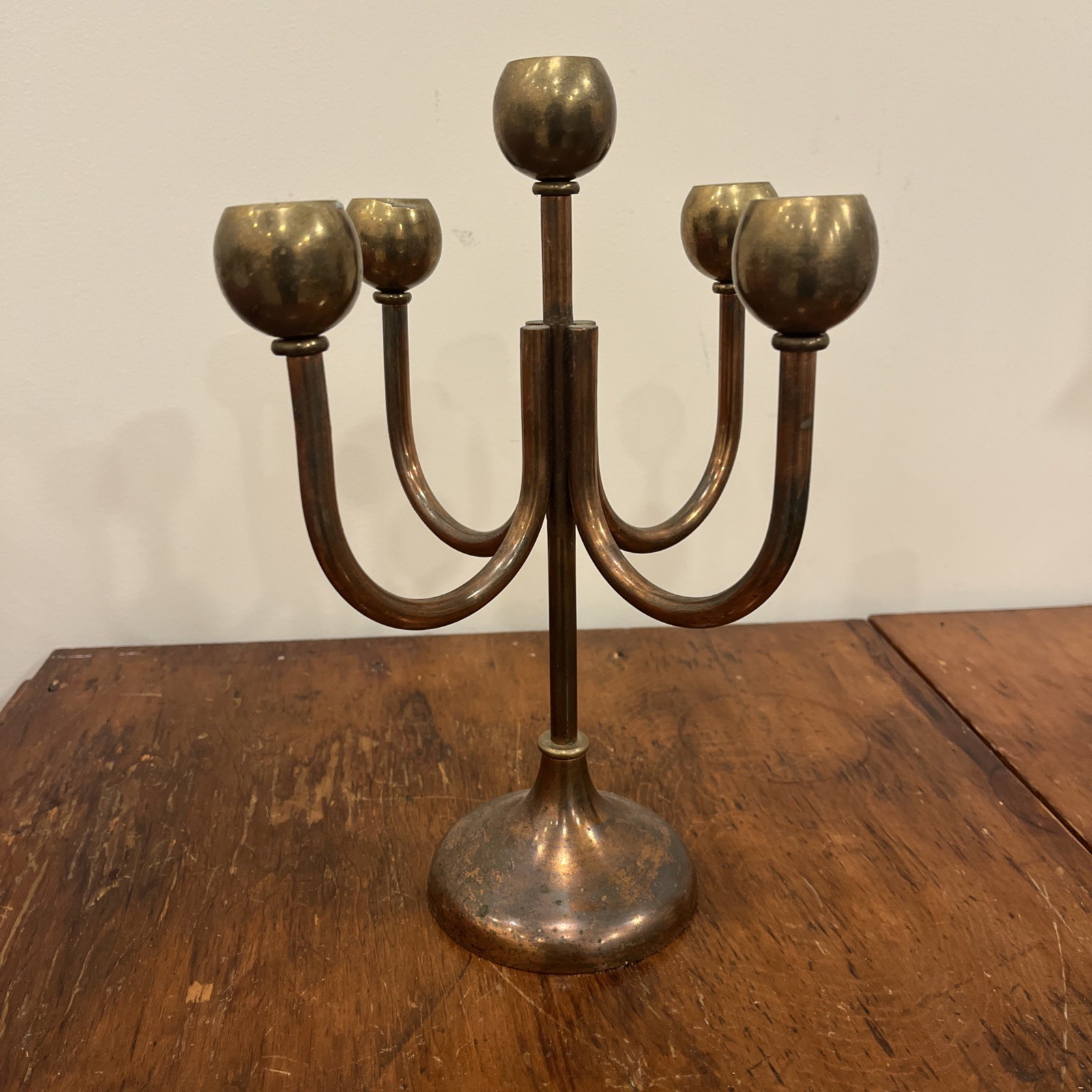 Five-arm brass and bronze candelabra with cast base
