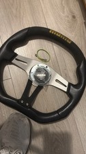 Genuine Momo Trek 350mm black leather, alcantara steering wheel and horn button.