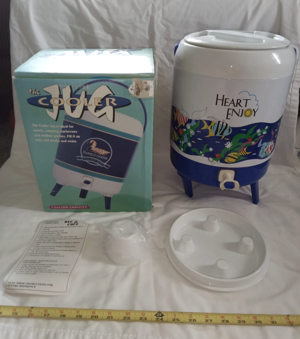 the Jug Cooler 2 Gallon Insulated Drink Cooler w/ handle, legs, paper, in box.