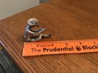 Miniature Pewter Cowboy in Sitting Position Removing His Boots — photo 2