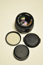 Minolta MD Rokkor-X 50mm f1.7 manual focus lens with 1A filter and caps.