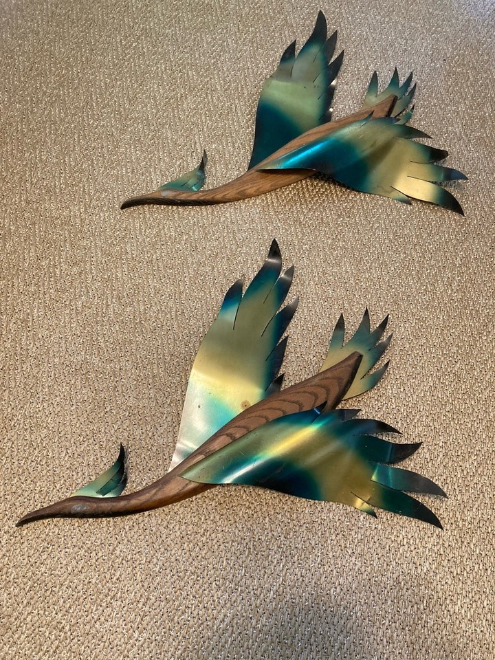 A classic MCM set of two teak-and-brass flying geese wall sculptures — timeless mid-century design that works in virtually any modern space.