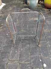 Antique Edwardian brass folding fire guard with a wire mesh infill and bun feet