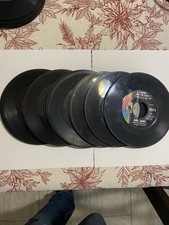 Stack of 25 45 rpm vinyl records. Various Artists And Record Labels