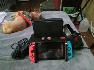nintendo switch. Basically new. Comes with games,case,headphones,etc