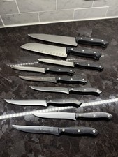 Set of 9 J.A. Henckels International Fine Edge Pro II Knives- Chef, Santoku