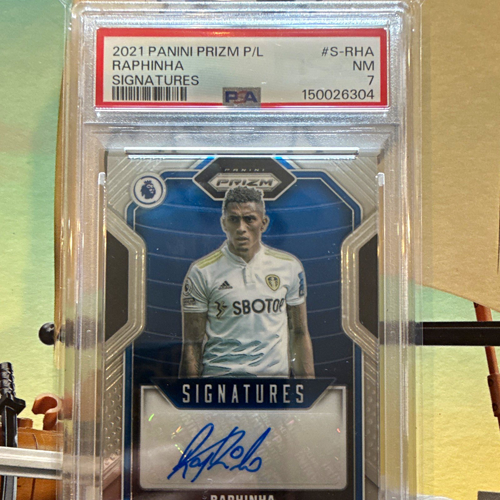 2021-22 PANINI PRIZM PREMIER LEAGUE RAPHINHA SIGNATURES #S-RHA AUTO PSA 7