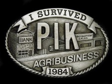 UA13142 VINTAGE 1984 I SURVIVED PIK AGRIBUSINESS FARM PROGRAM BELT BUCKLE
