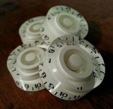 4 Guitar speed volume/tone knobs from 0-11..    Solid Cream.  JAT