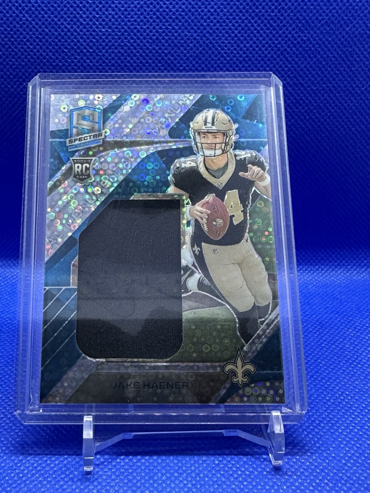 2023 Panini Spectra Jake Haener Monumental Rookie Jersey Patch Blue Neon /50