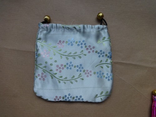 Embroidered pale green satin make up bag, size approx 12.5 x 12.5 cms