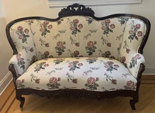 Victorian-style Carved Wood Parlor Loveseat Floral Fabric