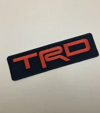 TRD Toyota Racing Development Iron On Patch. 7.25”x2” Solid Red On Black