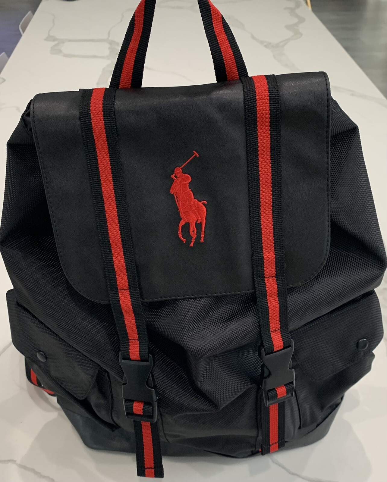 red polo backpack