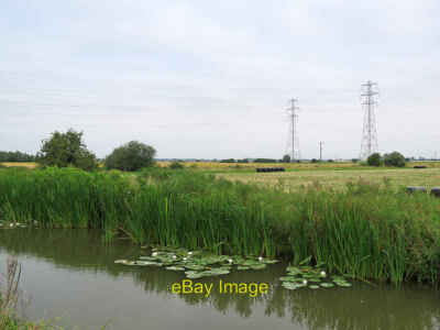 Foto 12x8 Reach Lode: Seerosen, Schilf und Pylone Ein bewölkter Sommermorgen um 2021