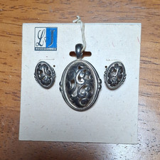LJ Accessories Silver Tone Pendant & Earrings...