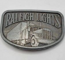 Vintage Raleigh Lights Belt Buckle Trucker Trucking Transportation Pewter