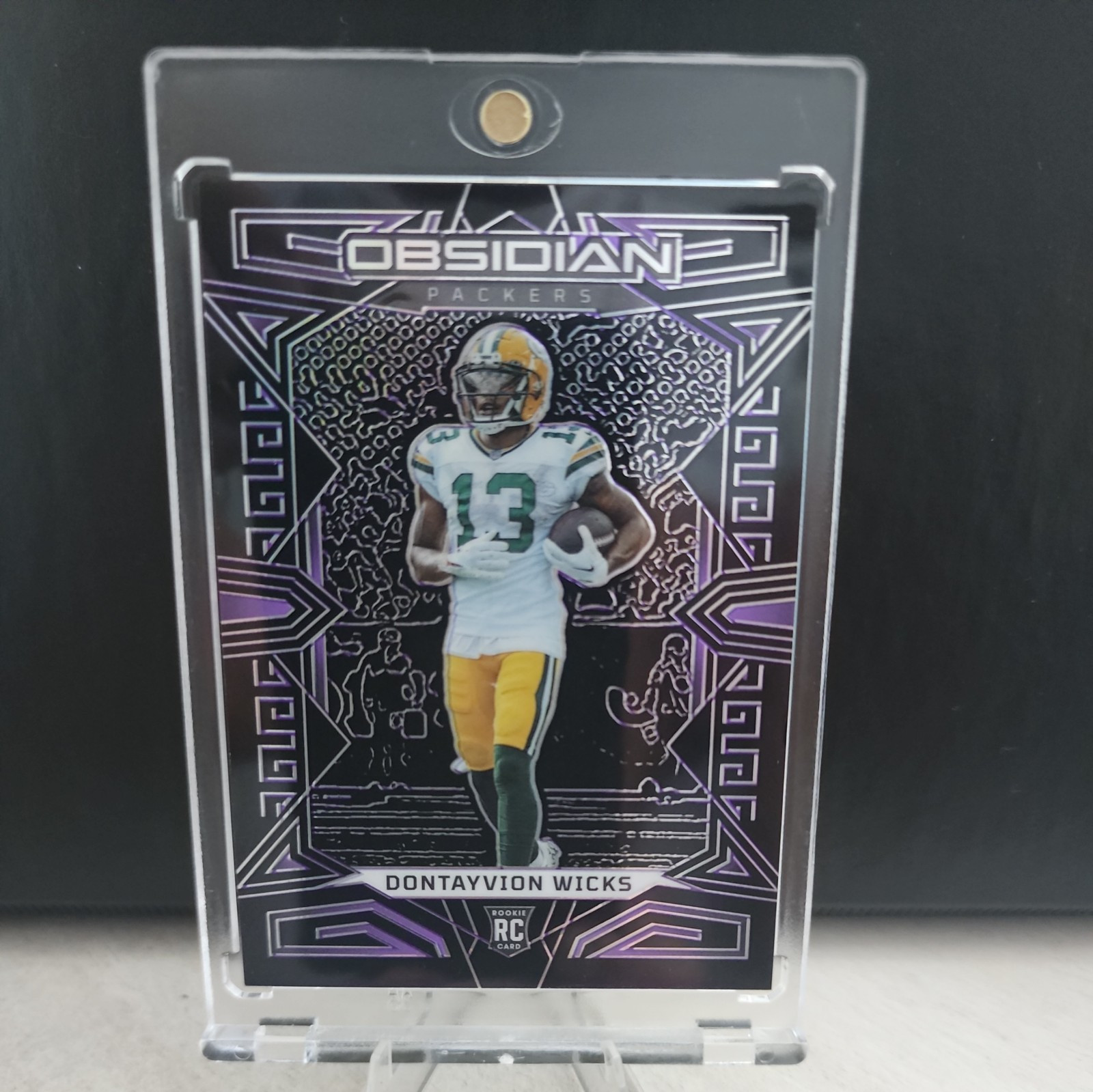 2023 Panini Obsidian #138 Dontayvion Wicks Purple Electric Etch RC /75