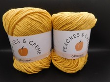 lot of 2 peaches  Creme 100 cotton yarn 2.5oz gold