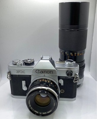 Canon FX 35mm Film SLR Camera with FL 50mm and FD 100-200mm Zoom