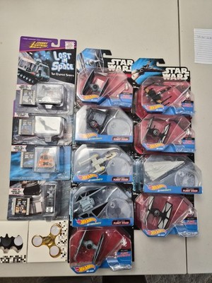 die cast Star Wars ships, lost in space, and spin toys.