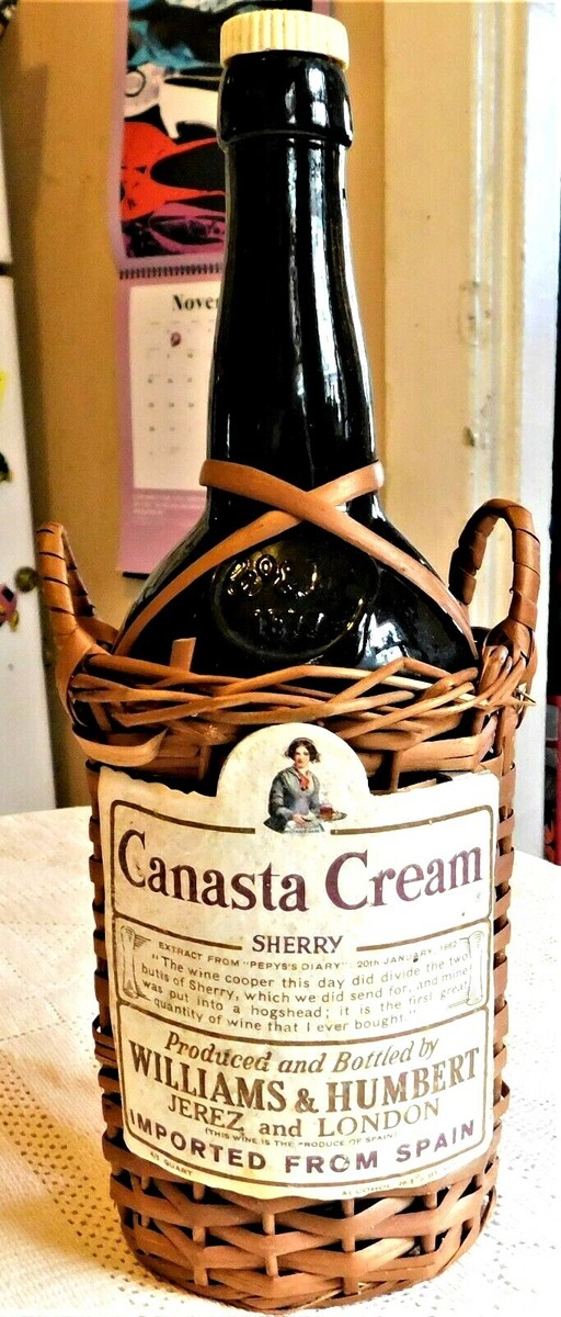 VINTAGE MID-20th CENTURY CANASTA CREAM SHERRY BOTTLE IN WICKER