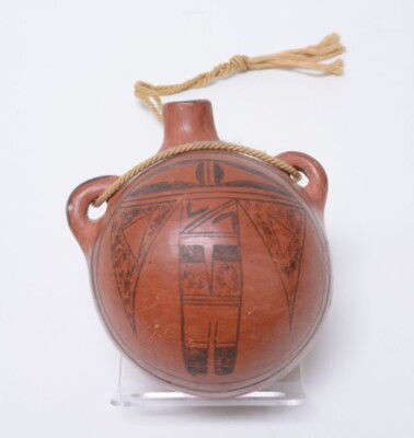 Fine Hopi Pueblo pottery, black on red canteen; Man Eagle design