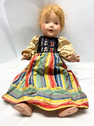 Antique hand painted doll colorful dress