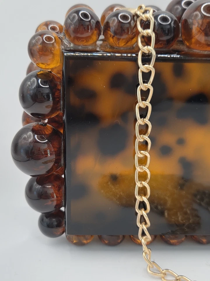 Cartera clutch Yendi leopardo tortuga acrílico Foto 2 de 4