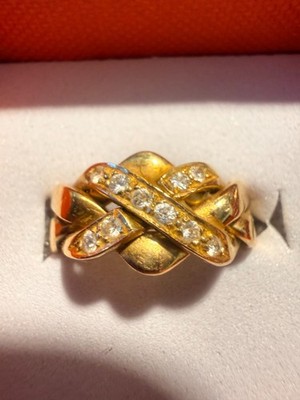 18k yellow gold puzzle ring w/diamond accents. Size 6 #91