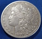 A 1890 CC MORGAN SILVER DOLLAR