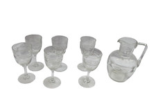 A set of collectible Baccarat crystal glasses with a carafe