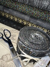 Jelly Roll Assorted black/gold/silver-40 strips 2.5" 100 cotton