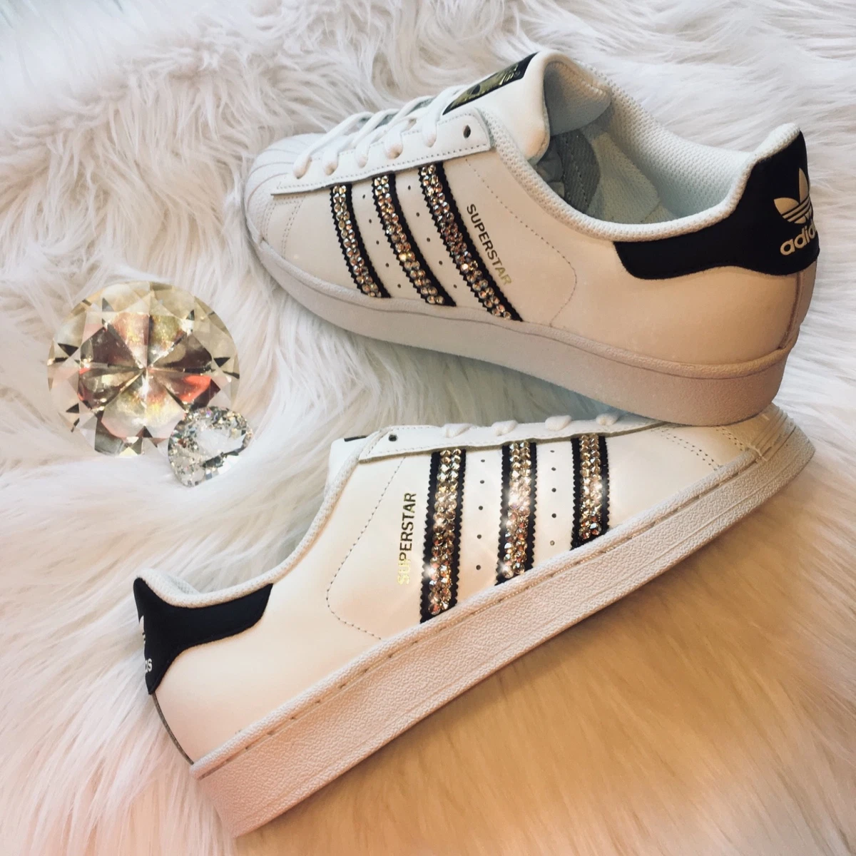 Adidas superstar nere clearance oro