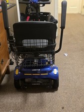 Electric blue scooter w/ f/r baskets, amrests, twin mittors drink holder NICE