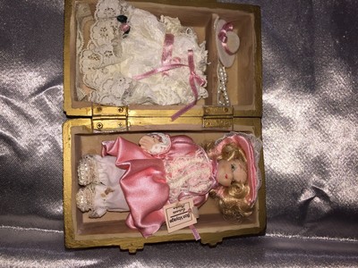 porcelain doll in wooden box