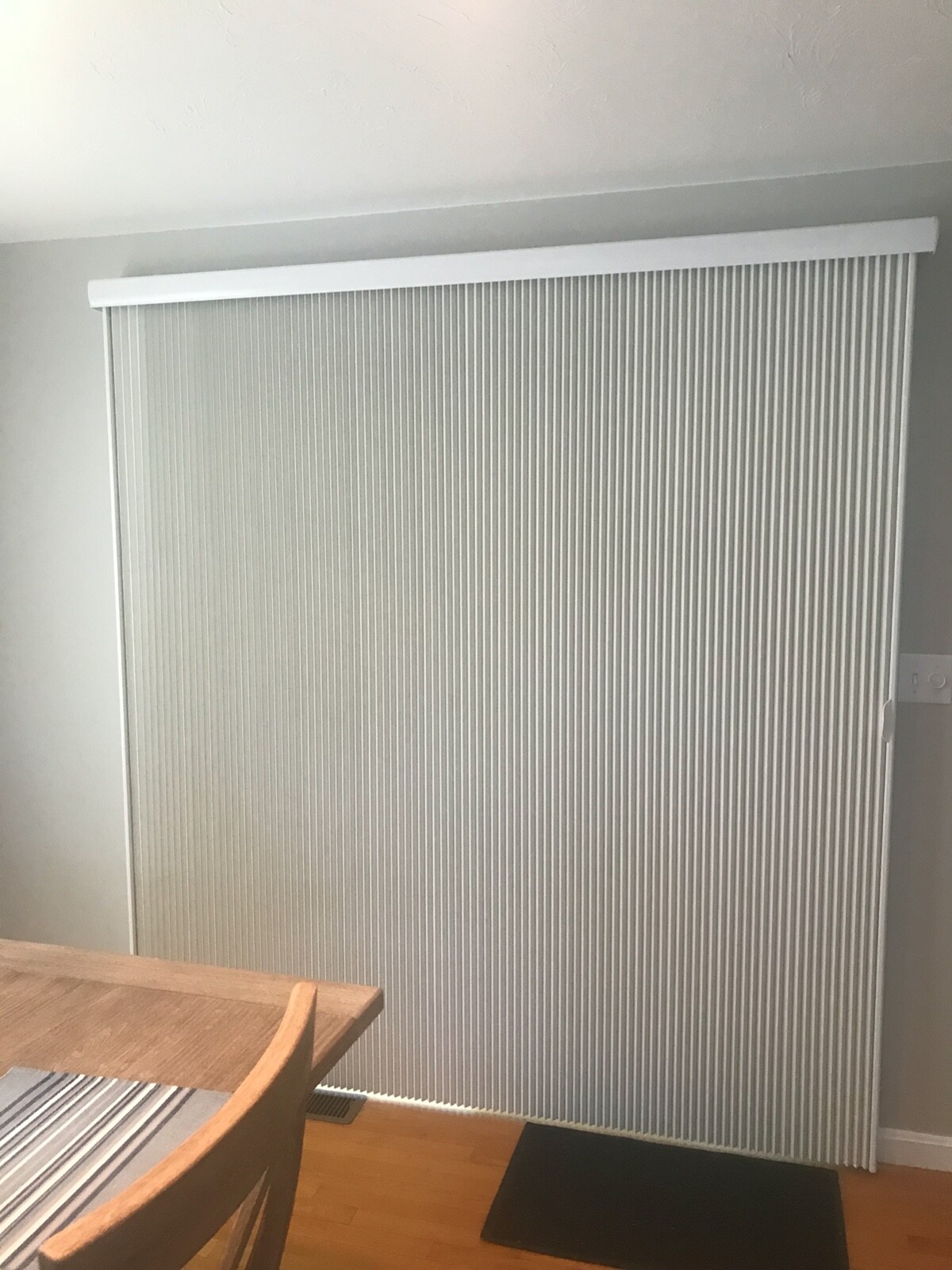 Alta honeycomb vertical sliding door window shade. 