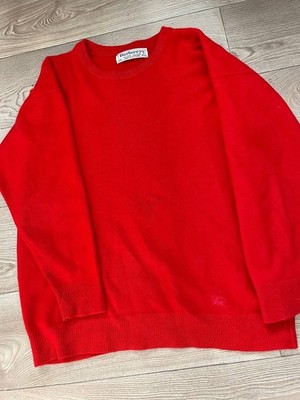 vintage red Burberry sweater with a crew neck and the brand's signature fabric l