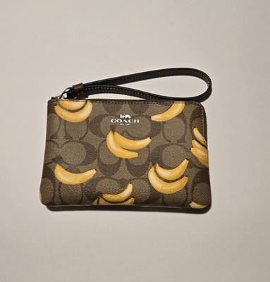 NWT. Coach Corner Zip Wristlet in Signature Canvas with banana