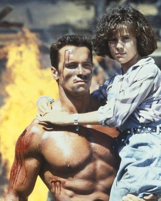 Arnold Schwarzenegger and Alyssa Milano in Commando 8x10 Publicity Photo