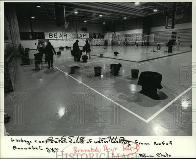 #ad 1984 Press Photo Trash cans catch some of water leaking at Bonnabel High School $24.99