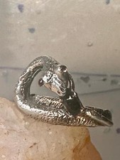 Snake ring size 6.50 holding a stone probably onyx purple stone eyes sterling si